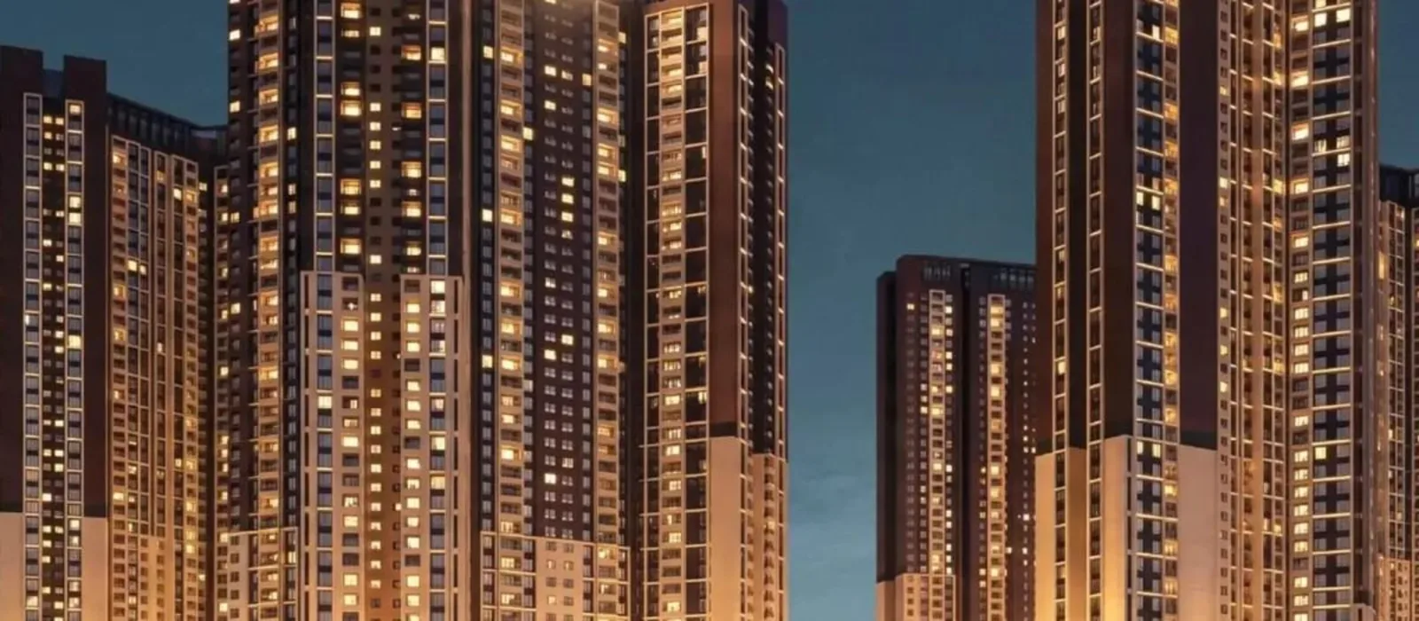 Prestige Velachery illuminated towers at dusk